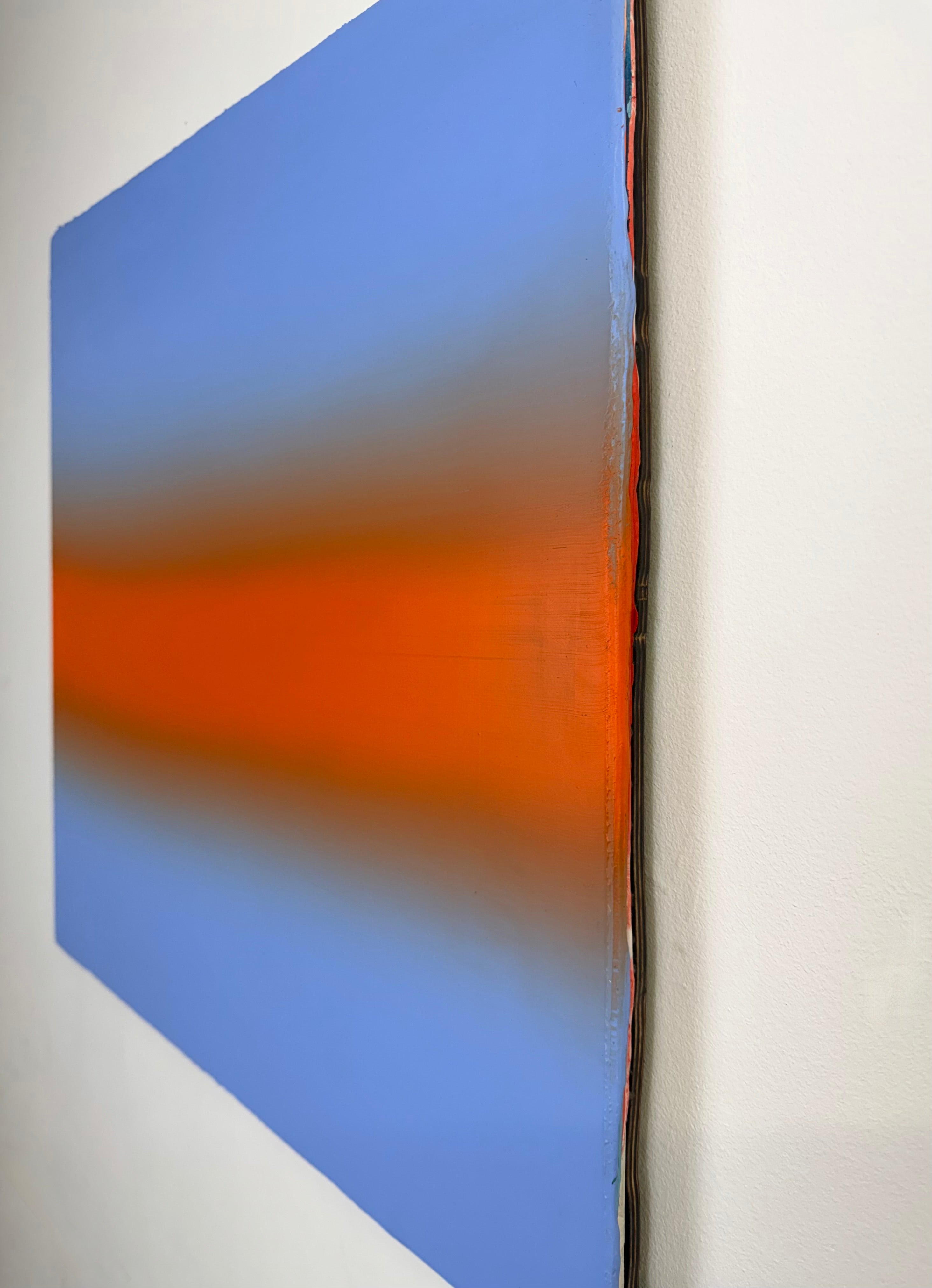 Original minimalist artwork by Welsh Artist Elfyn Lewis. Acrylic paint on MDF board to create a calming yet striking appearance through a dramatic warm orange band, radiating amongst a calm light blue at the top and base, reflecting feelings of a diminishing sunset landscape.