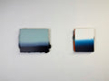 Original minimalist diptych artwork by Welsh Artist Elfyn Lewis. Two Acrylic painting on MDF panels to create a strong visual identity and cohesive art language. The two abstract art pieces reflect the change in a costal setting, from stormy seas of deep indigos to the calmer and serene water of white and light blue palettes. 