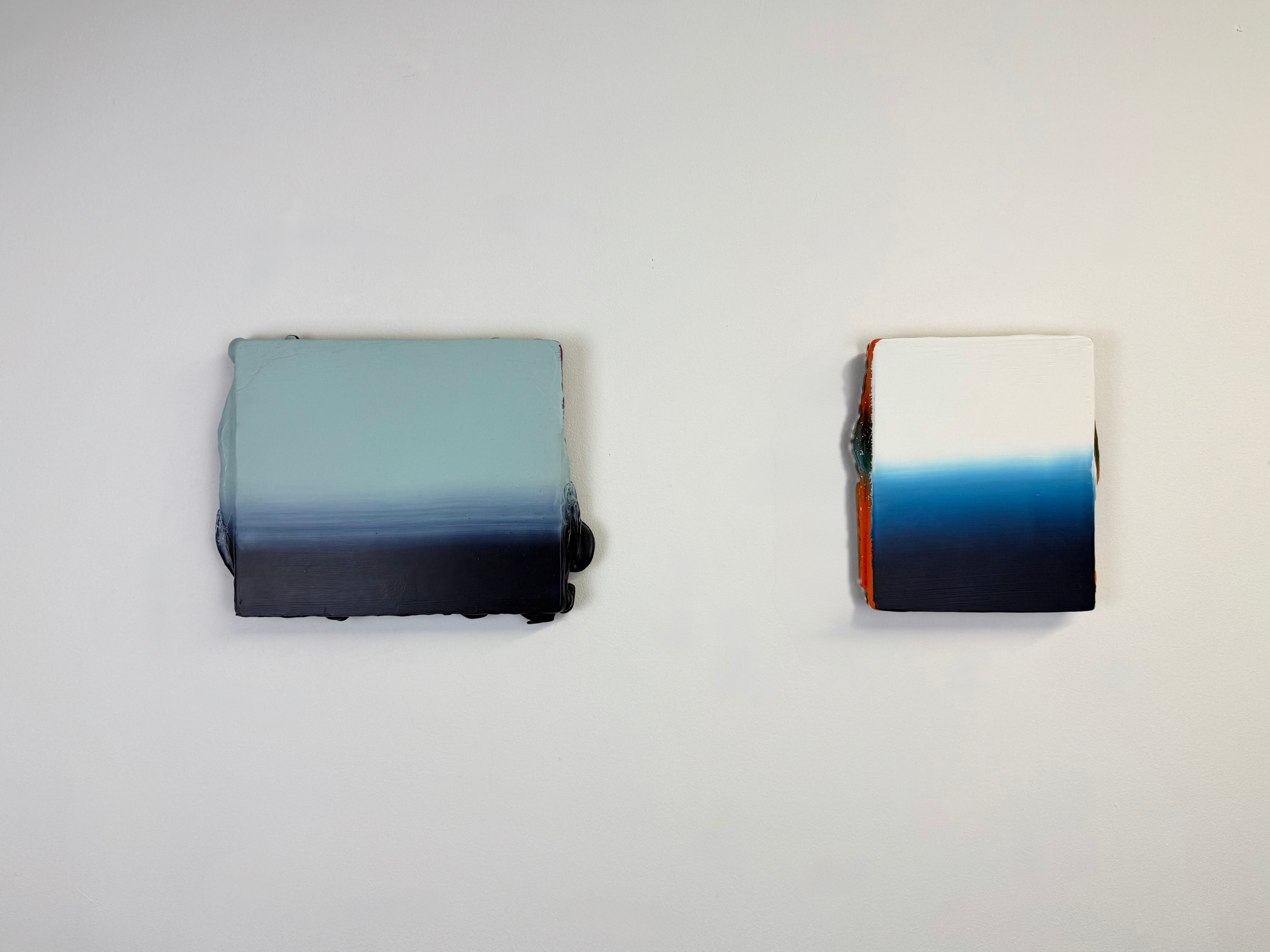 Original minimalist diptych artwork by Welsh Artist Elfyn Lewis. Two Acrylic painting on MDF panels to create a strong visual identity and cohesive art language. The two abstract art pieces reflect the change in a costal setting, from stormy seas of deep indigos to the calmer and serene water of white and light blue palettes. 