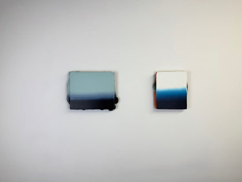 Original minimalist diptych artwork by Welsh Artist Elfyn Lewis. Two Acrylic painting on MDF panels to create a strong visual identity and cohesive art language. The two abstract art pieces reflect the change in a costal setting, from stormy seas of deep indigos to the calmer and serene water of white and light blue palettes. 