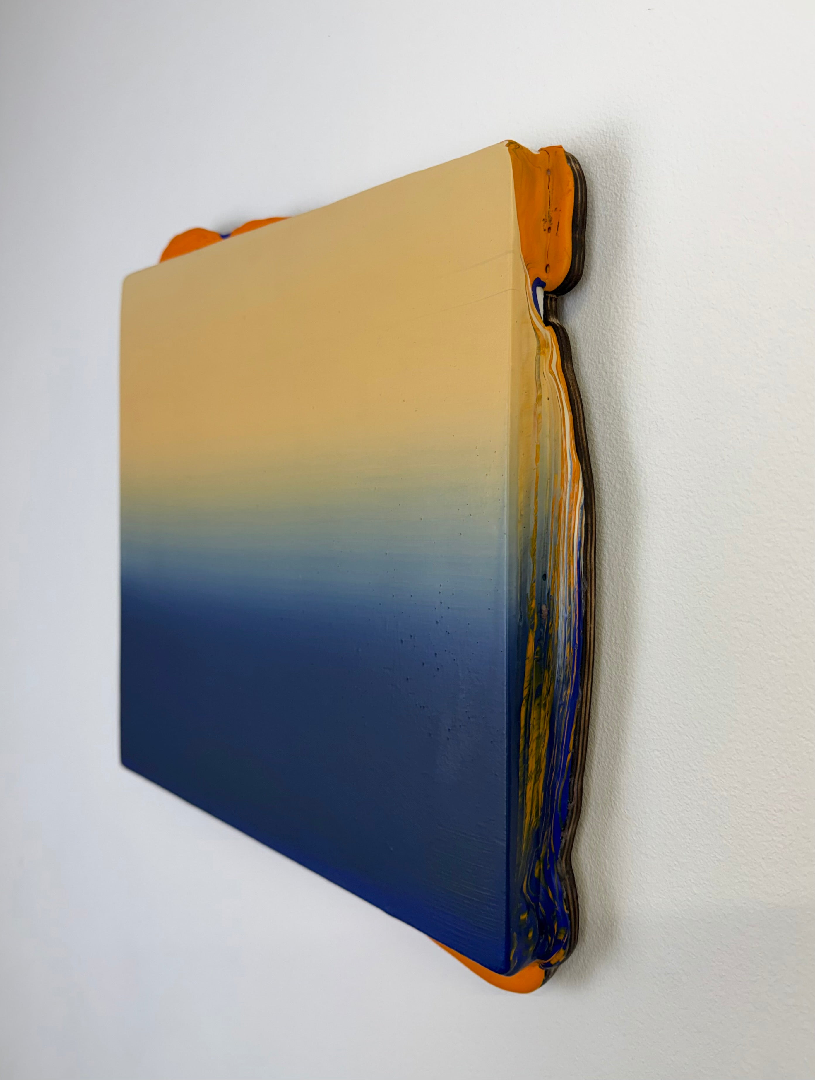 Original contemporary artwork by Welsh Artist Elfyn Lewis. Acrylic paint on MDF board to create a 3D effect with a calming yet striking appearance. An abstract landscape piece inspired by a horizon line at twilight, with colours of warm cream transitioning into dark blue.