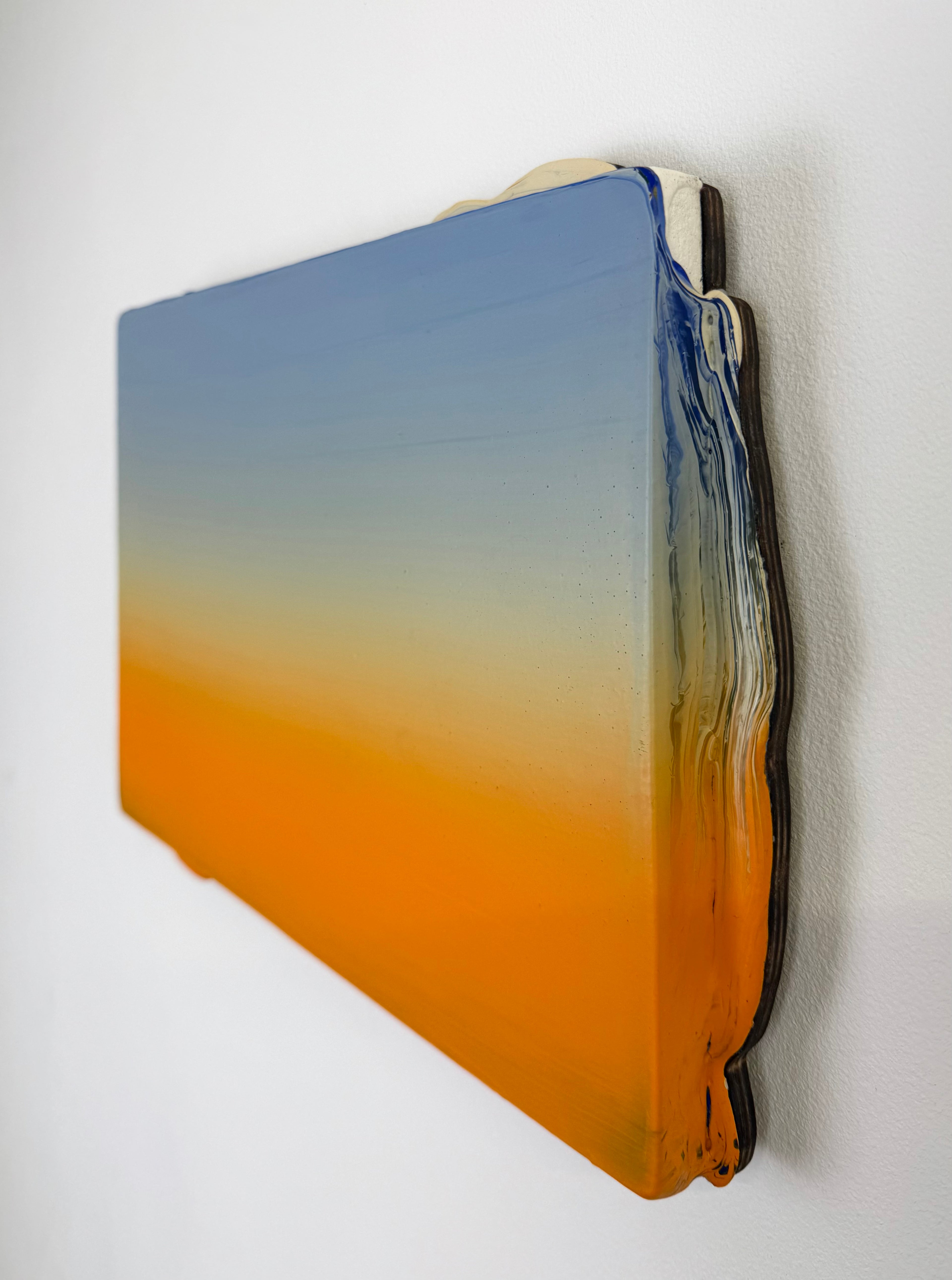 Original minimalist artwork by Welsh Artist Elfyn Lewis. Acrylic paint on MDF board to create a 3D effect with a calming yet striking appearance. An abstract landscape piece inspired by a coastal landscape at sunset, with colours of light blue transitioning into vivid orange. 