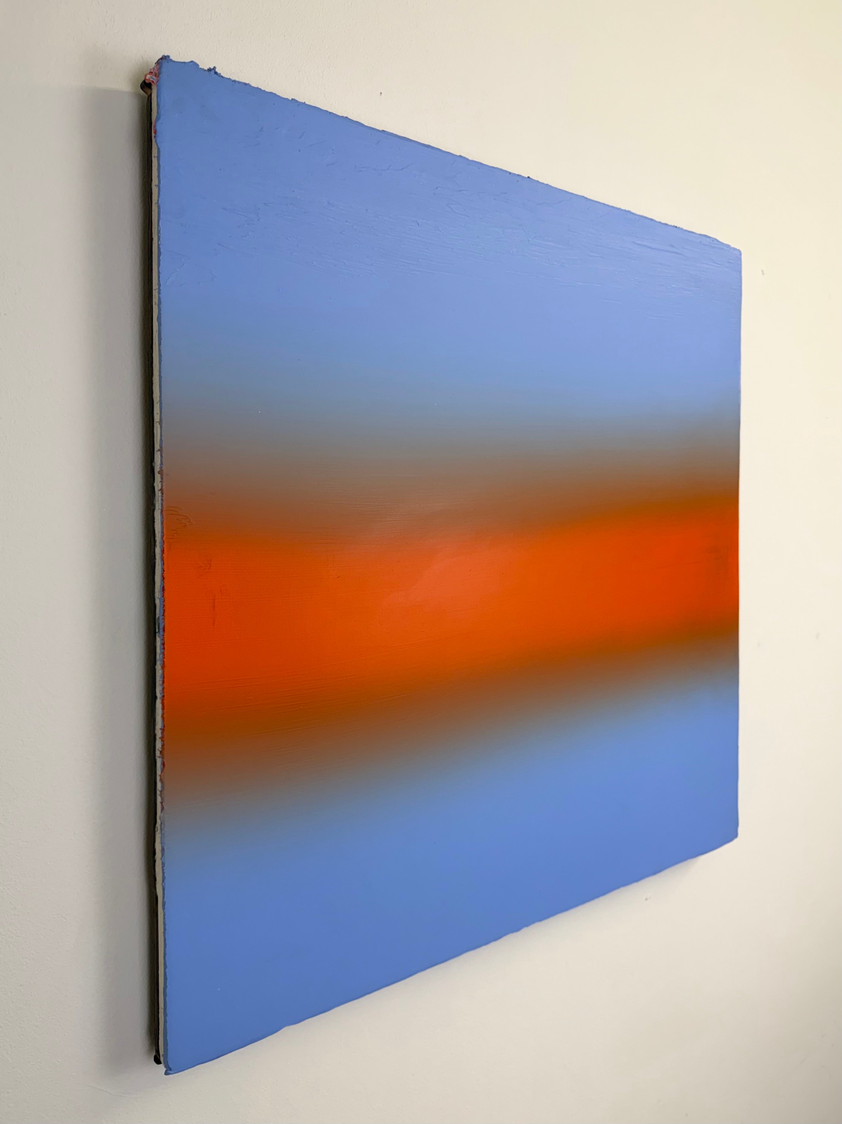 Original minimalist artwork by Welsh Artist Elfyn Lewis. Acrylic paint on MDF board to create a calming yet striking appearance through a dramatic warm orange band, radiating amongst a calm light blue at the top and base, reflecting feelings of a diminishing sunset landscape. 