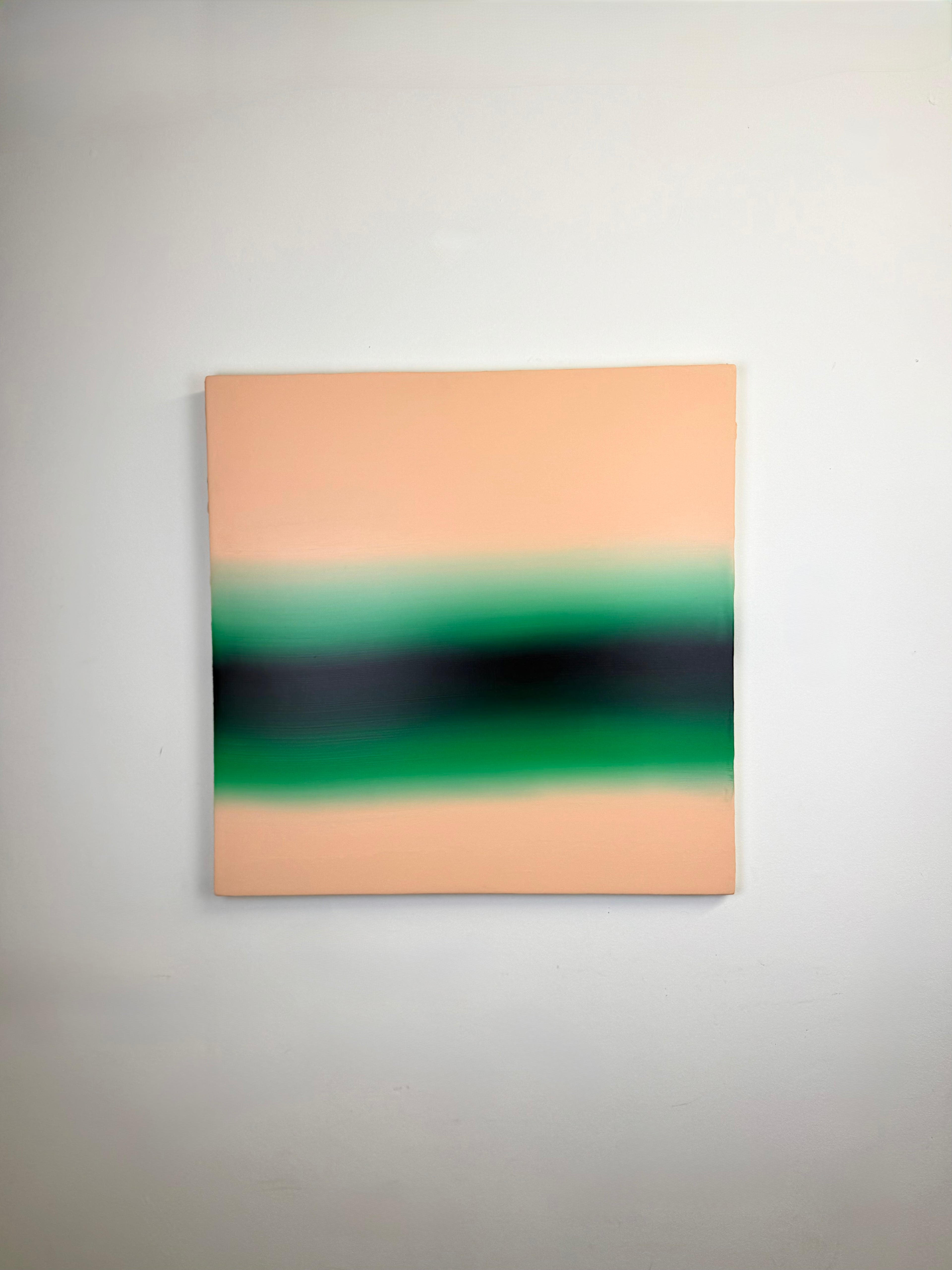 Original minimalist artwork by Welsh Artist Elfyn Lewis. Acrylic paint on MDF board to create a calming yet striking appearance through a dramatic emerald green band radiating between subtle salmon pinks to reflect the early morning light of a rural green landscape in Wales. 