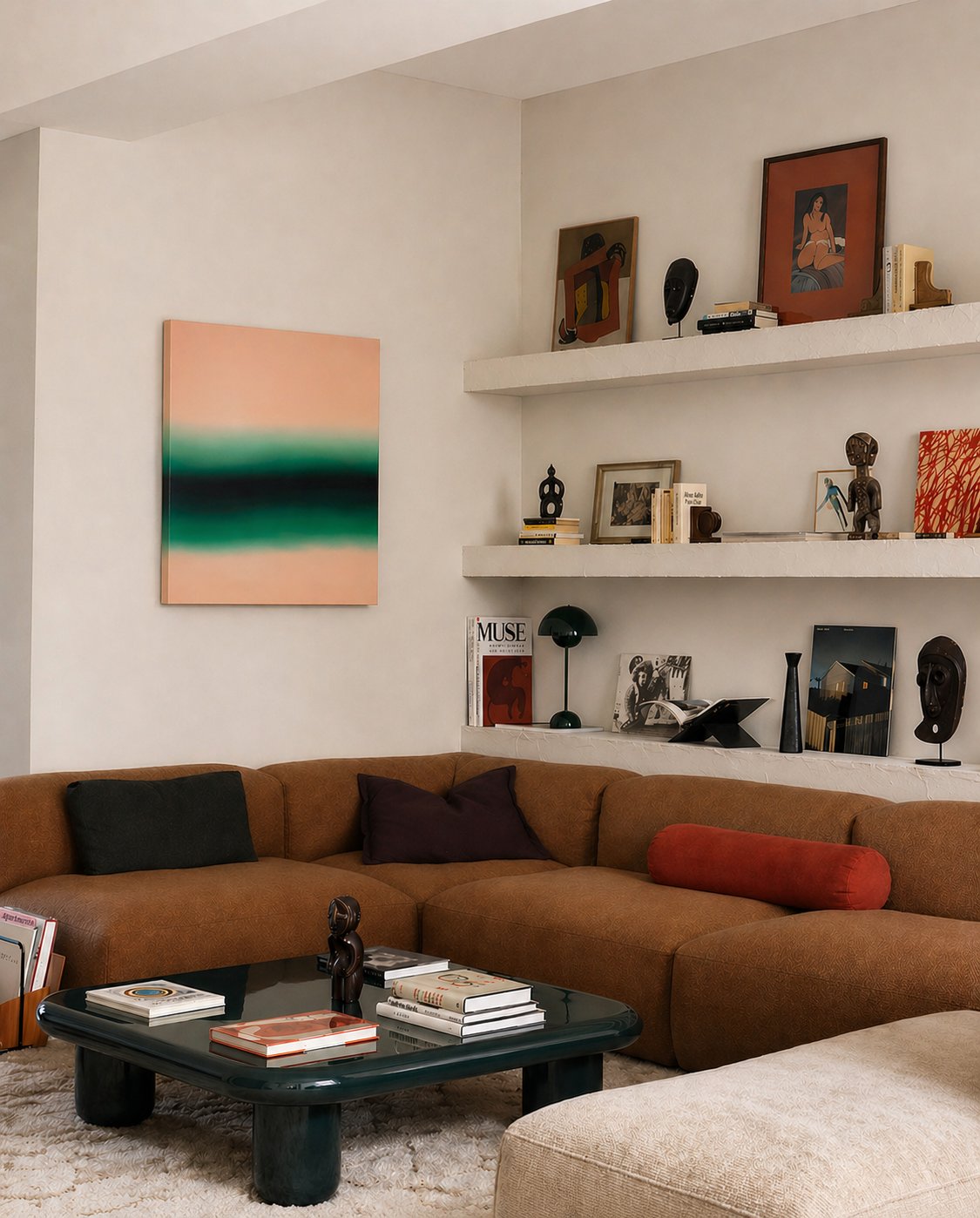 Living room with brown sectional sofa, coffee table, and wall art