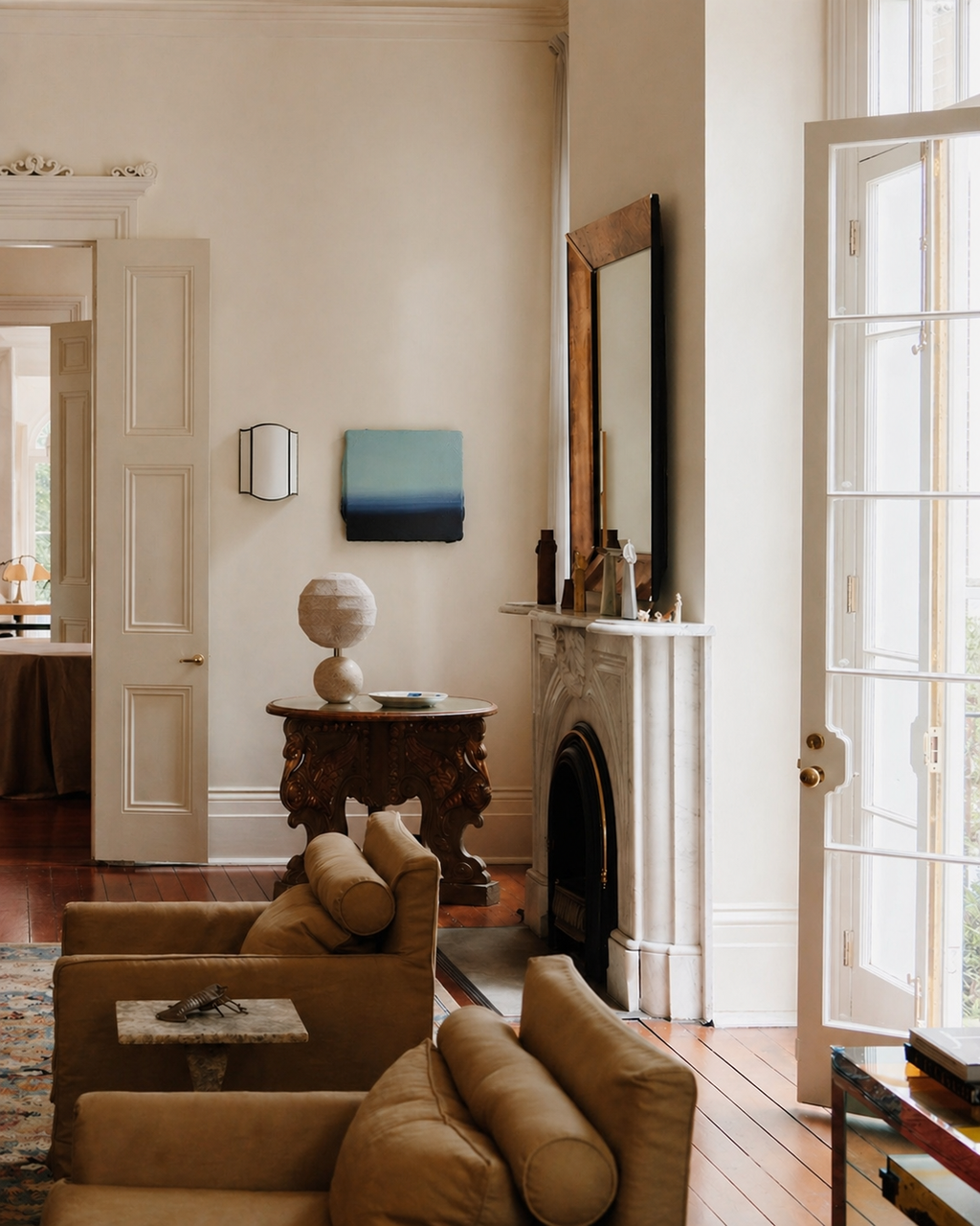 Living room with beige sofa, wooden side table, and fireplace.
