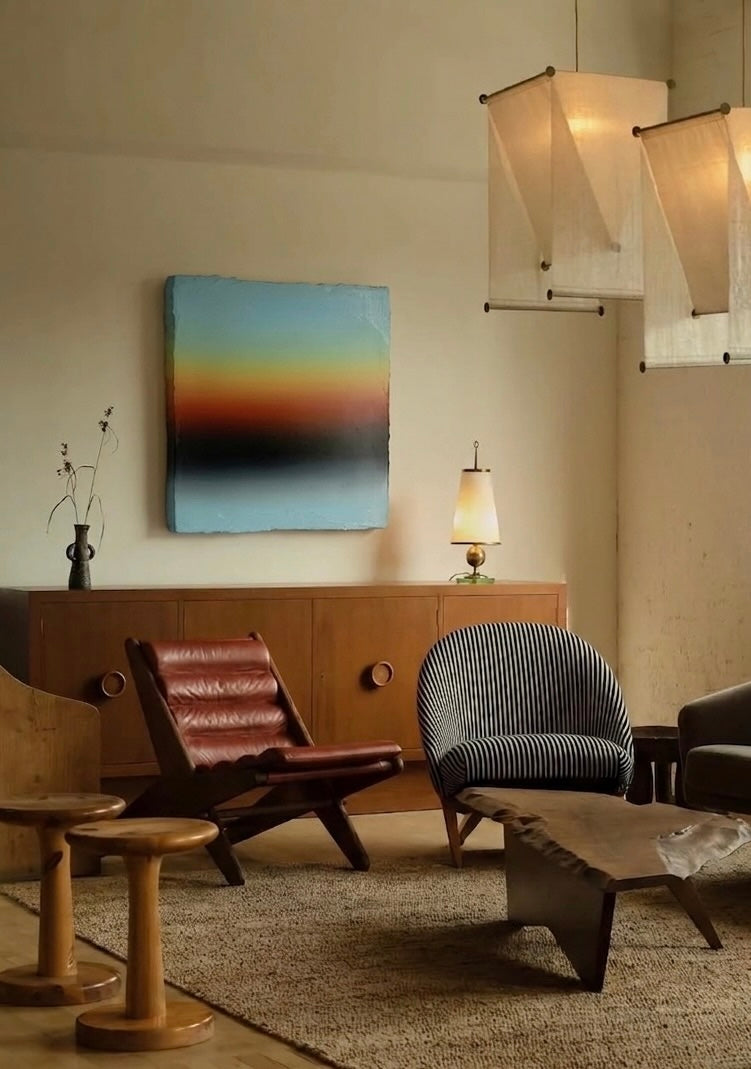 Modern living room with vintage furniture and abstract art