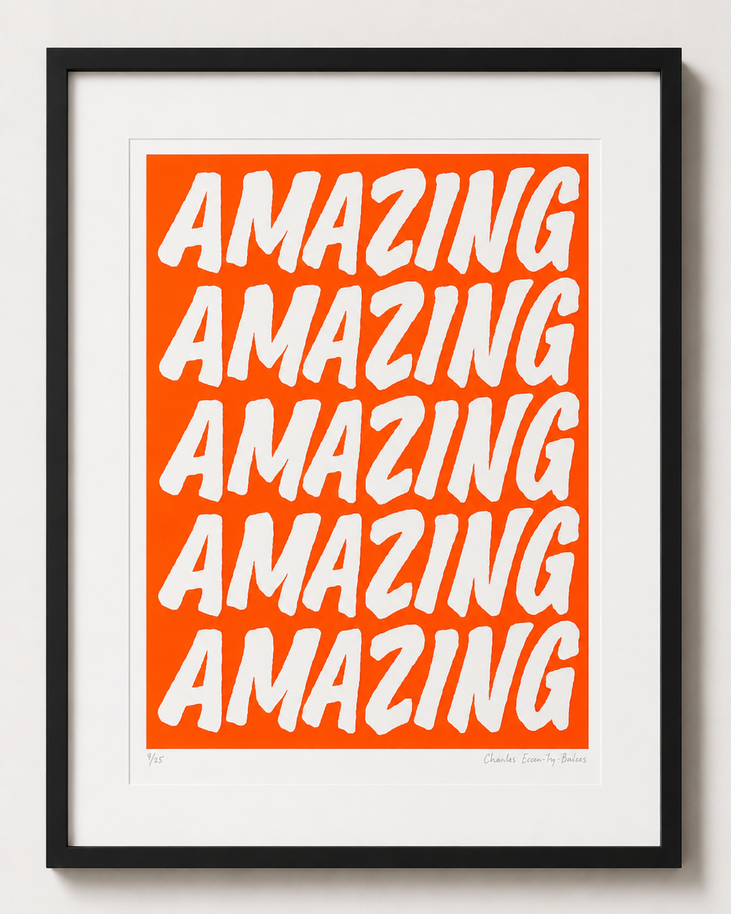 Framed artwork with 'AMAZING' text on an orange background