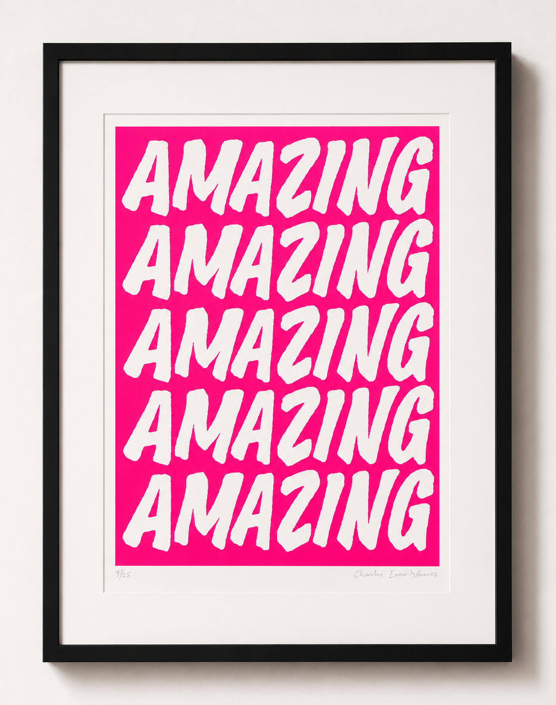 Framed artwork with 'AMAZING' text on a pink background