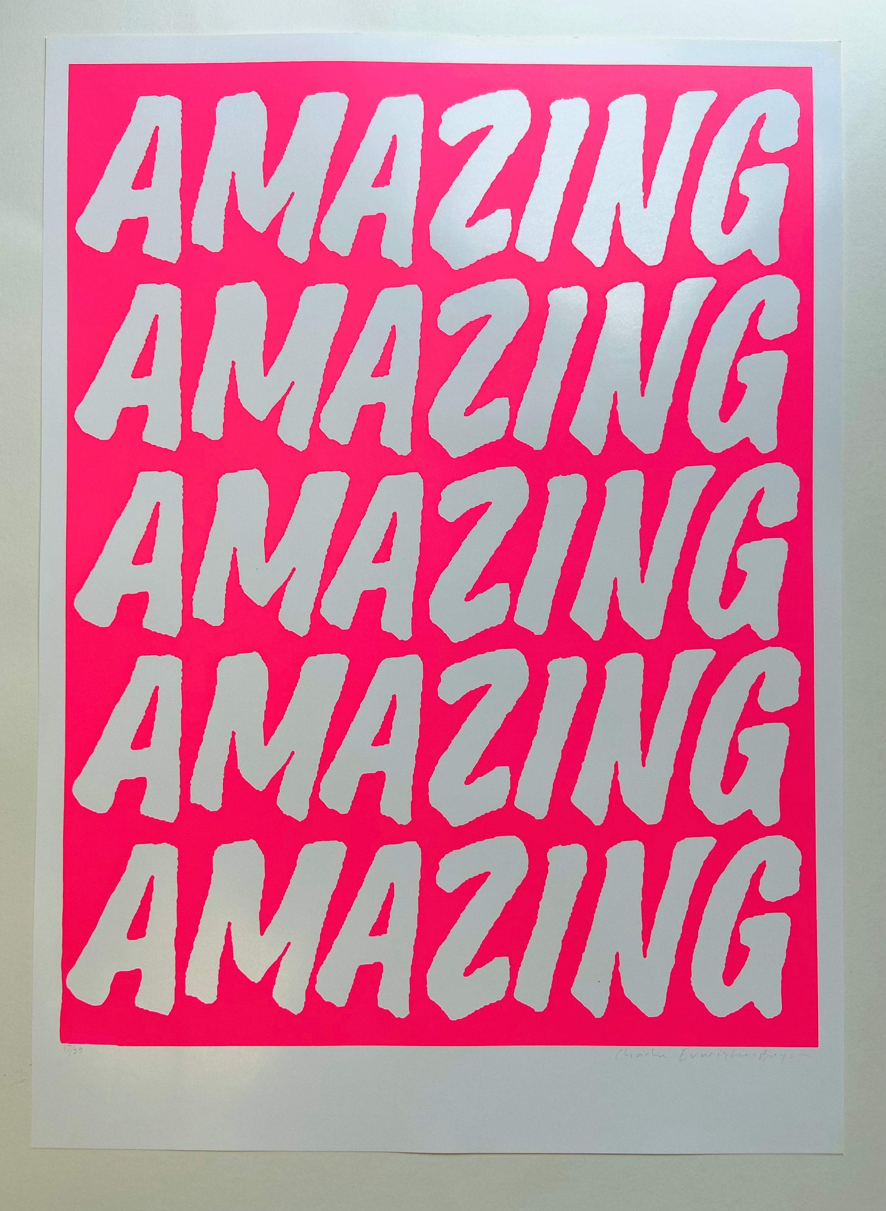 Repetition of the word 'AMAZING' in white text on a pink background