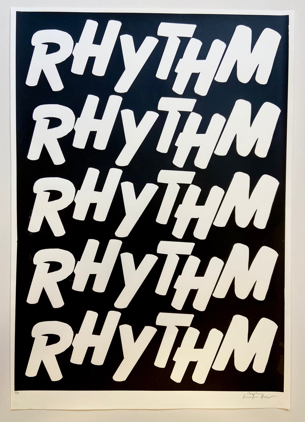 Repetition of the word 'RHYTHM' in white text on a black background