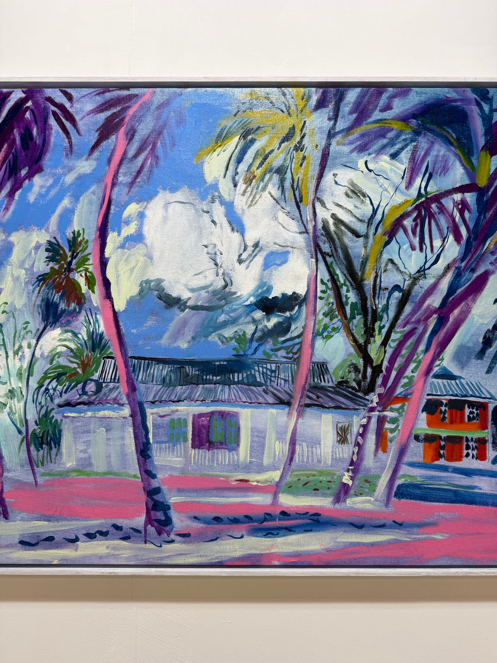 A colorful painted tropical scene showing palm trees in front of white buildings under a blue sky with clouds, Life beneath the palms. colourful abstract art by Hannah Rollings.